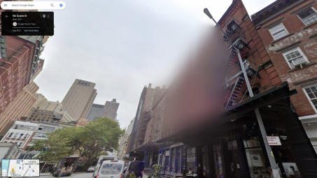 a nyc apartment building blurred on street view