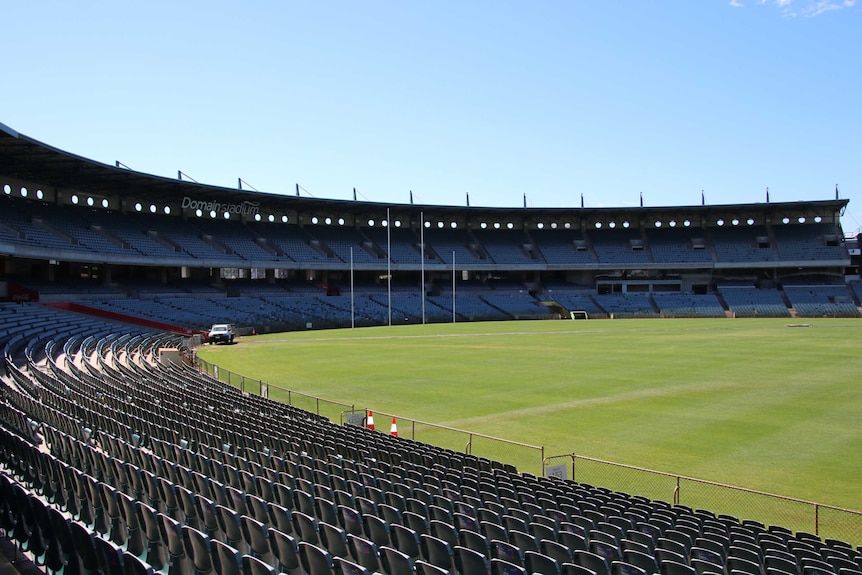A wide shot of the two-tier stand at the city end of Subiaco Oval with the playing surface in front.