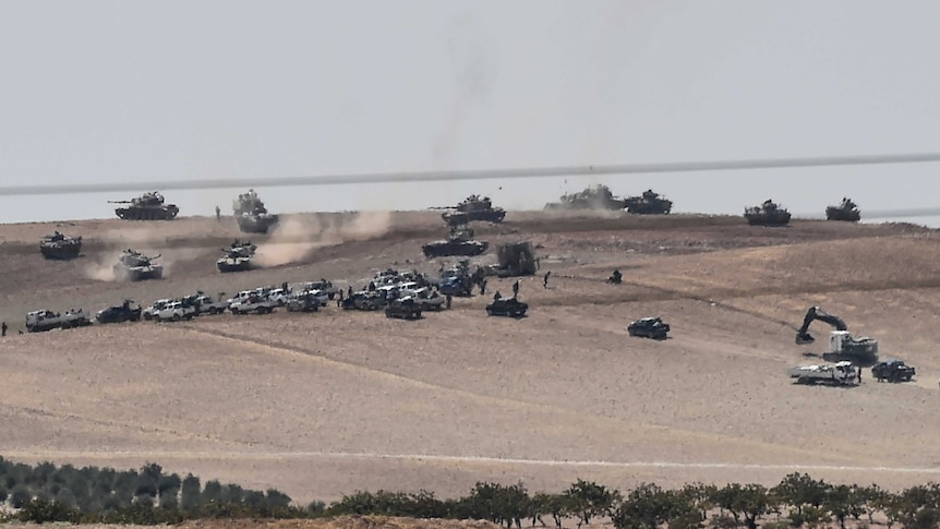 Turkish army tanks and pro-Ankara Syrian opposition fighters west of Jarabulus.