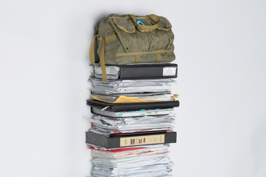 A stack of papers and bags.