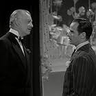 Russell Hicks and Marc Lawrence in Hold That Ghost (1941)