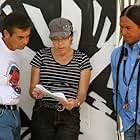 "Urban Rez" executive producer, writer, editor Lisa D. Olken reviewing script with director Larry Pourier and host Moses Brings Plenty. 