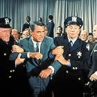 Cary Grant, Ken Lynch, and Patrick McVey in North by Northwest (1959)