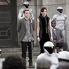 Afemo Omilami, Josh Hutcherson, and Jennifer Lawrence in The Hunger Games: Catching Fire (2013)