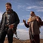 Gerard Butler and Navid Negahban in Kandahar (2023)