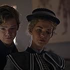 Thomas Brodie-Sangster and Maia Mitchell in The Artful Dodger (2023)
