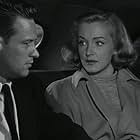 William Holden and Nina Foch in The Dark Past (1948)