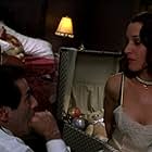 Jennifer Beals and David Proval in Four Rooms (1995)