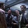 Bill Paxton, Arnold Schwarzenegger, Brad Rearden, and Brian Thompson in The Terminator (1984)