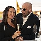 John Travolta and Kristin Davis in Cash Out (2024)