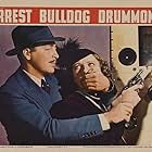 Jean Fenwick and John Howard in Arrest Bulldog Drummond (1938)