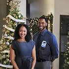 Tamera Mowry-Housley and Ronnie Rowe in Inventing the Christmas Prince (2022)