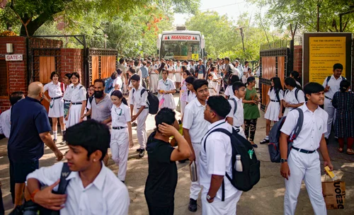 PTI : Students come out of the DPS School after a bomb threat was received by the school via e-mail, at Sector 30, in Noida, Wednesday, May 1, 2024.