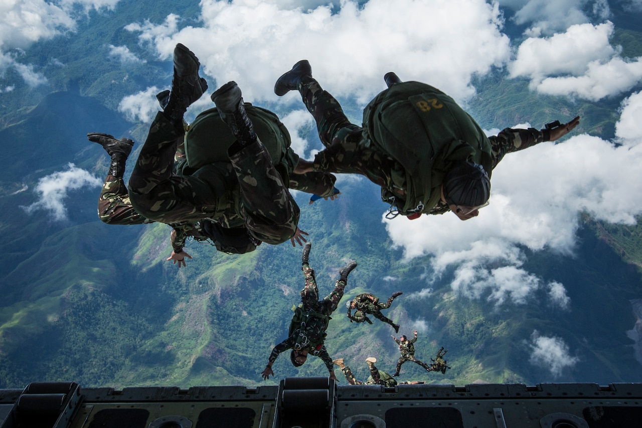 Soldiers jumping out of aircraft