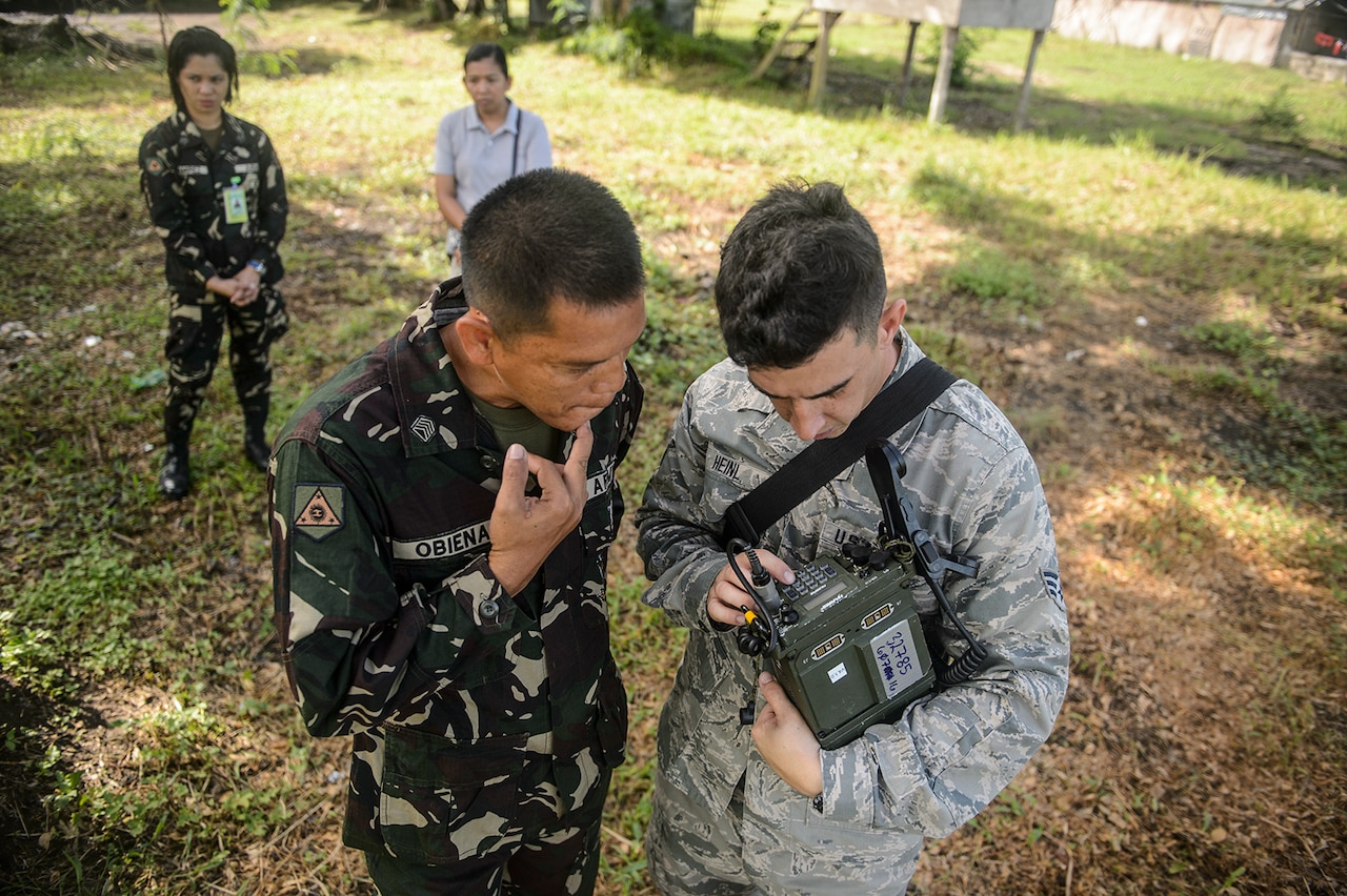 U.S. Air Force Senior Airman Jason Heinl, right, explains a communication device to a Philippine service member during Pacific Partnership 2015 in Capiz, Philippines, July 29, 2015. Pacific Partnership, in its tenth iteration, is the largest annual multilateral humanitarian assistance and disaster relief preparedness mission conducted in the Indo-Asia-Pacific region.