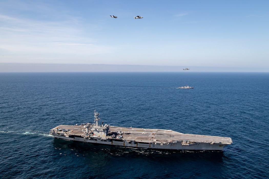 USS George Washington (CVN 73) and ships from the Peruvian navy transit in formation during a photo exercise while underway in the Pacific Ocean.