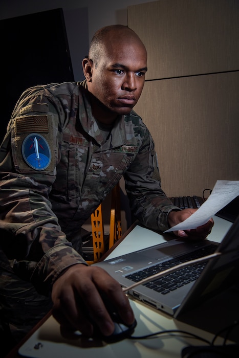 An Airman looks at his computer