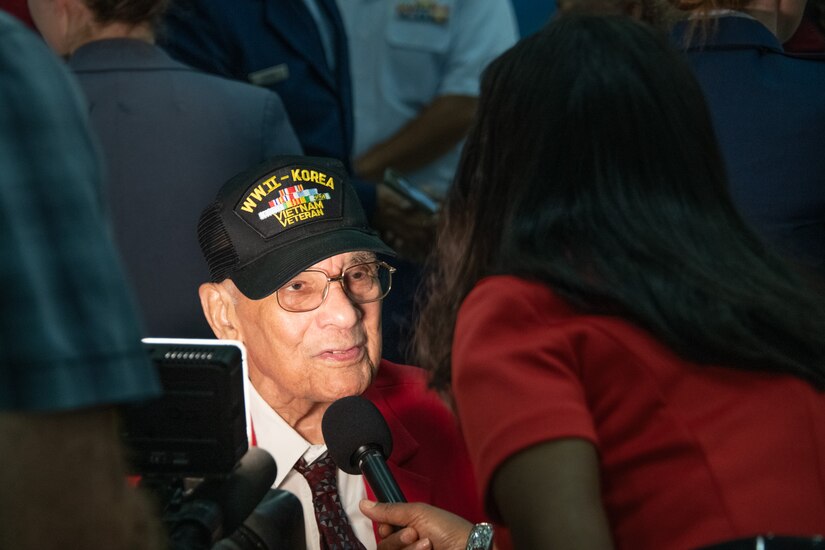 Retired Col. Carl C. Johnson, a Tuskegee Airman, answers interview questions during the Tuskegee Airmen PT-17 Stearman Aircraft Exchange ceremony at Joint Base Andrews, Md., July 26, 2023. The ceremony coincided with the 75th anniversary of the signing by President Harry S. Truman of Executive Order 9981 directing the military to end segregation. (U.S. Air Force photo by Senior Airman Tyrone Thomas)