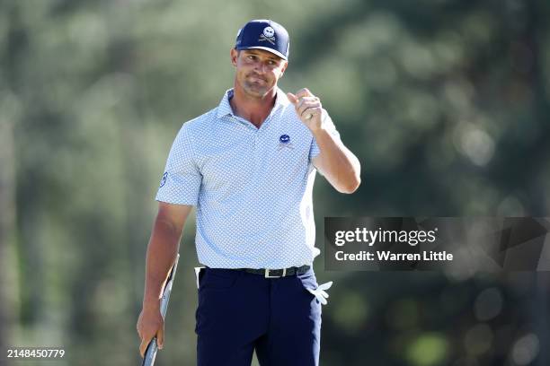 Bryson DeChambeau of the United States reacts on the 18th green during the second round of the 2024 Masters Tournament at Augusta National Golf Club...