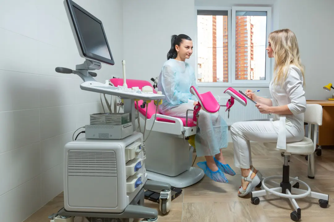 Gynecologist talking to patient