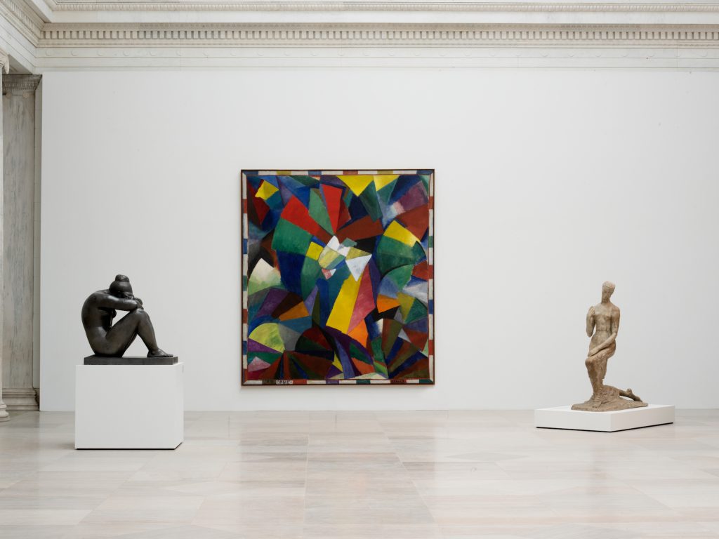 31 View of the Sculpture Court in the Wilmers Building with, from left to right, Aristide Maillol, La Nuit (Night), 1902-1909; Morgan Russell, Synchromy in Orange: To Form, 1913- 1914; Wilhelm Lehmbruck, Die Knieende (Kneeling Woman), 1911. Photo by Gregory Halpern.