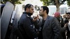 A demonstrator argues with a policeman during a protest in the centre of Tunis