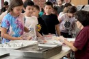 Students at a summer latchkey program at Dodge Elementary School get free lunch as part of a program funded by the U.S. Department of Agriculture.
