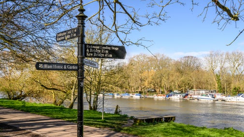 Signpost near the Thames riverside pointing to Ham House and Garden, London