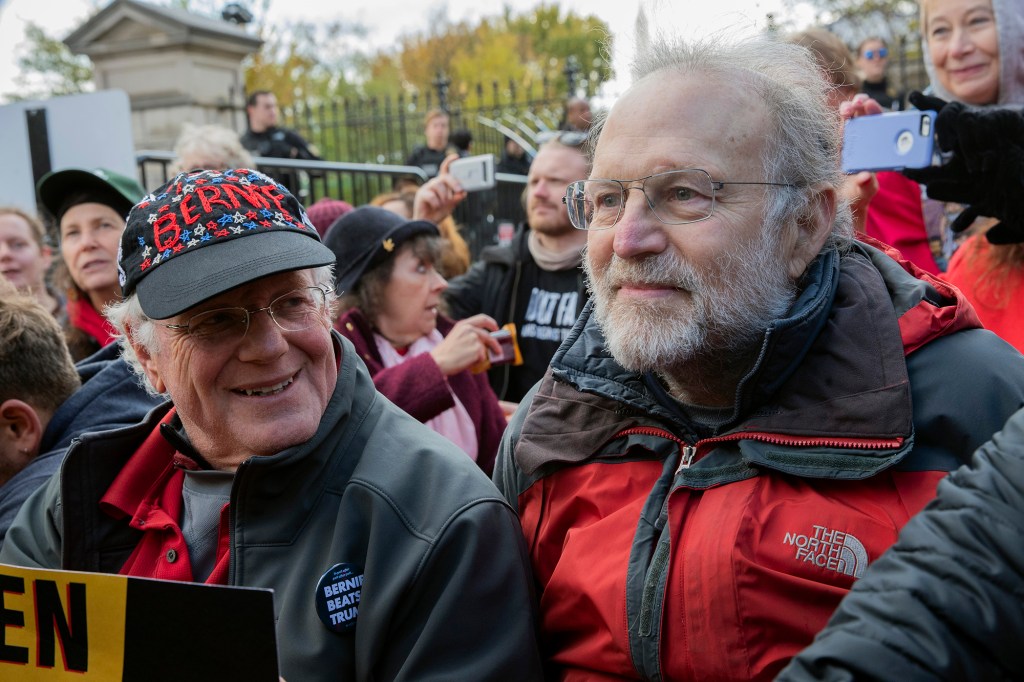 In this Nov. 8, 2019 file photo, Ben Cohen, left, and Jerry Greenfield, co-founders of Ben & Jerry's ice cream, attend a protest in Washington.