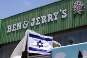 An Israeli flag is set atop a delivery truck outside US ice-cream maker Ben & Jerry's factory in Be'er Tuvia, on July 21, 2021. - Ben & Jerry's announced that it will stop selling ice cream in the Israel-occupied Palestinian territories since it was "inconsistent with our values", although it said it planned to keep selling its products in Israel. The West Bank and East Jerusalem have been under Israeli control since 1967. Roughly 475,000 Jewish settlers live in the West Bank, in communities widely regarded as illegal under international law, alongside some 2.8 million Palestinians. (Photo by Emmanuel