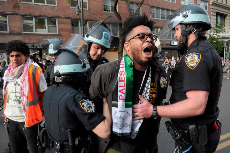 Members of the New York City Police Department arrest a pro-Palestine demonstrator during a rally on May 7.