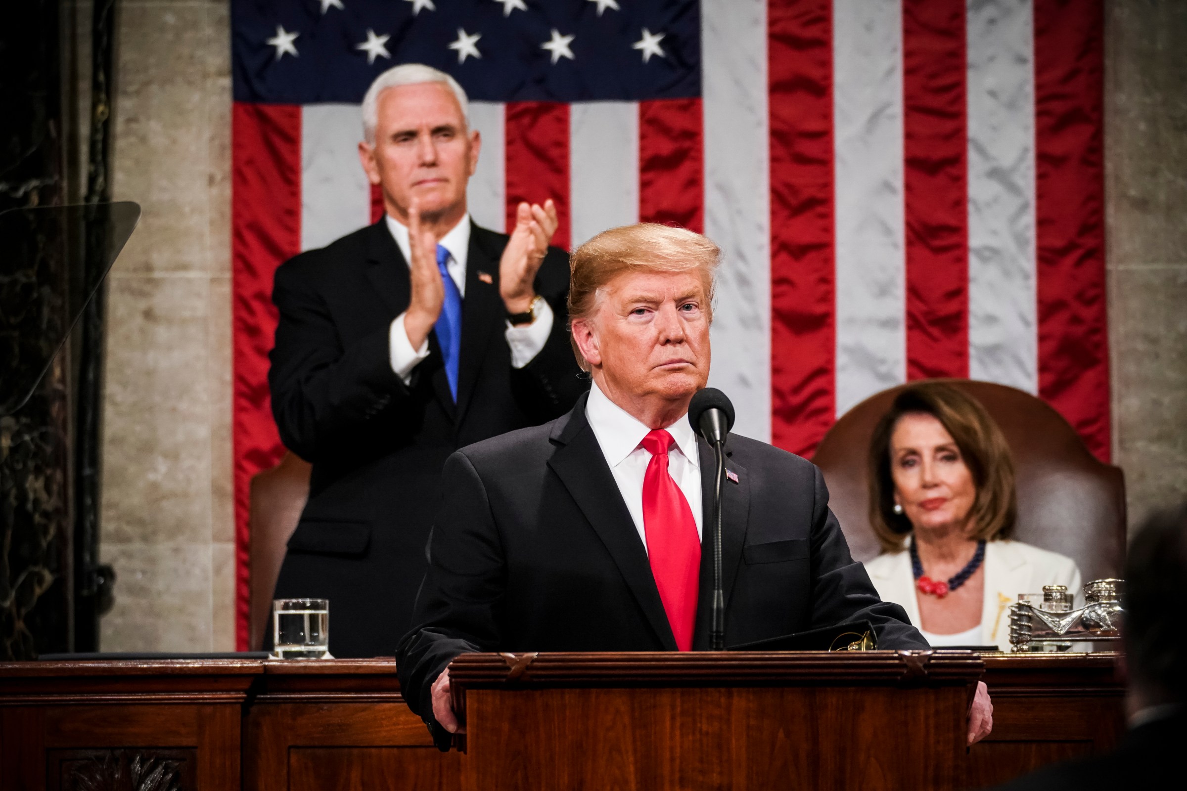 President Trump, with Speaker Nancy Pelosi and Vice President Mike Pence looking on, delivers the State of the Union address on February 5, 2019.