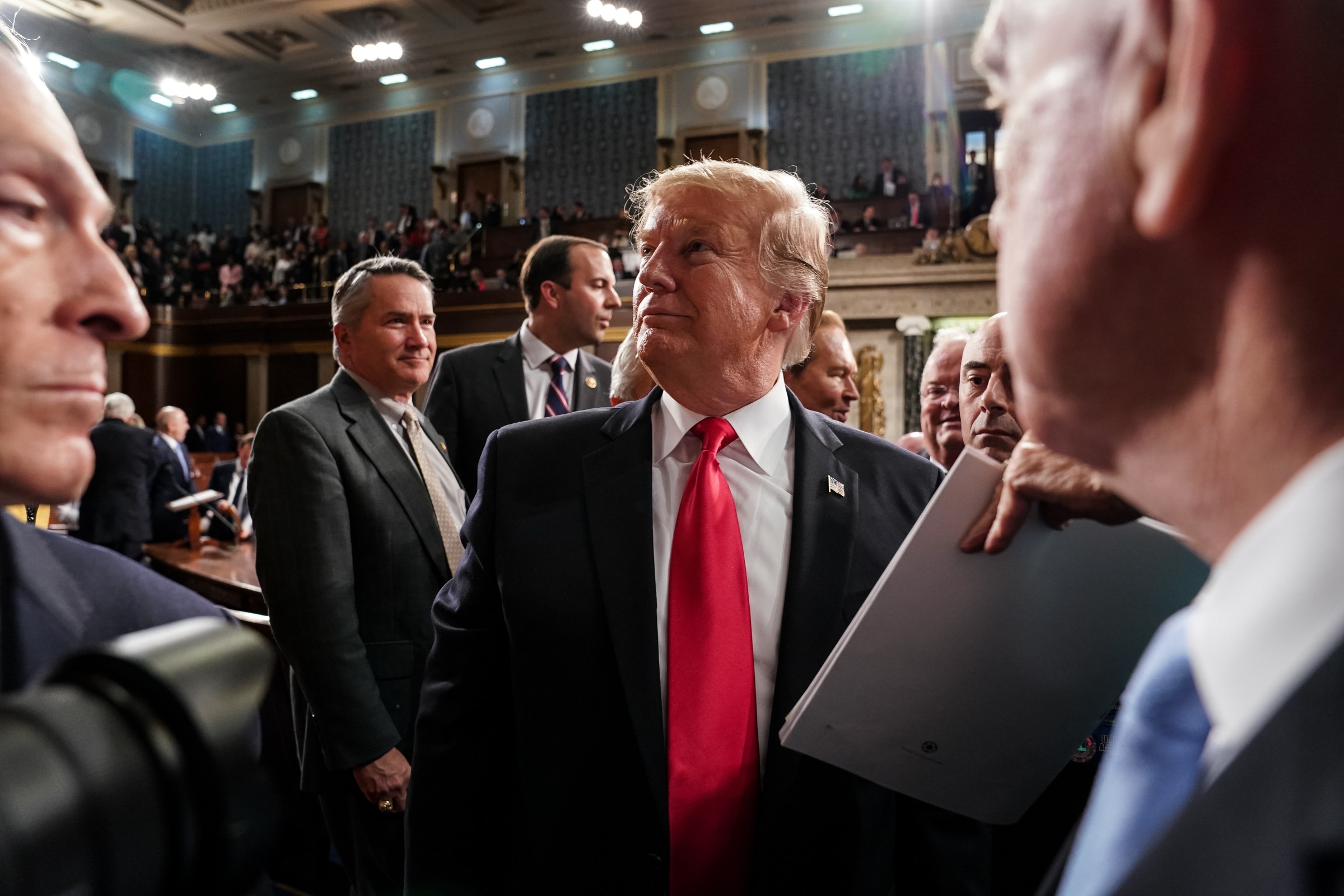 President Donald Trump departs the chamber of the House of Representatives after delivering the State of the Union address in February 2019.