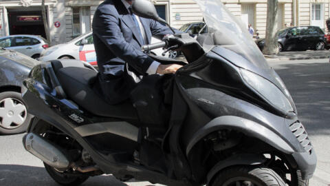 Candidate for the French Socialist Party 2012 primary elections, Francois Hollande is pictured on his scooter in Paris in 2011.