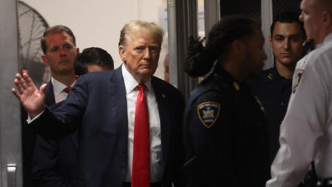 Former U.S. President Donald Trump returns after a break in his criminal trial for allegedly covering up hush money payments at Manhattan Criminal Court on May 28, 2024 in New York City.
