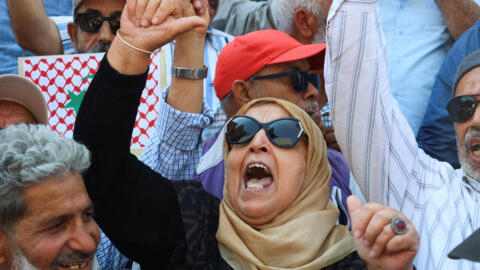 A demonstrator at a protest demanding the release of imprisoned lawyers, journalists, activists and opposition figures in Tunis, Tunisia, May 12, 2024.