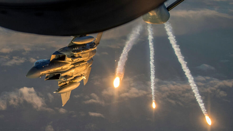 File photo of a US Air Force F-15 Eagle deploying flares during a refuelling mission above Iraq.