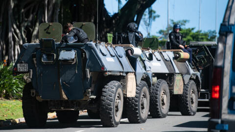 Gendarmerie armoured vehicles are seen near a police station in Noumea, France's Pacific territory of New Caledonia, on May 18, 2024. 