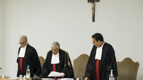 Vatican tribunal president Giuseppe Pignatone reading the verdict of a trial against Cardinal Angelo Becciu and nine other defendants in the Vatican press room, December 16, 2023.