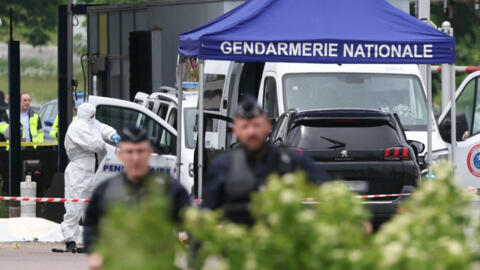 A forensic expert inspects the vehicles involved in the attack, which took place at a road toll in Incarville in the Eure region, in northern France, on May 14, 2024.