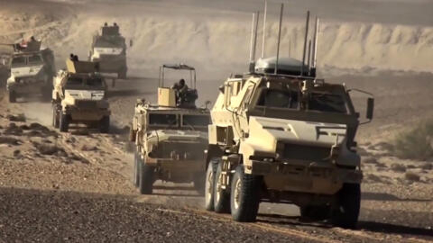 An image grab taken from a handout video released by the official Facebook page of Egypt's Military Spokesman on December 8, 2020 shows an Egyptian army armoured personnel carriers (APCs) driving in the desert. 