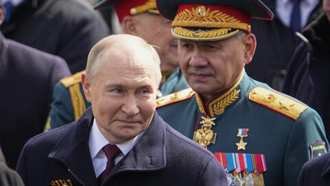 Russian President Vladimir Putin and then-defense minister Sergei Shoigu leave Red Square after the Victory Day military parade in Moscow, Russia, Thursday, May 9, 2024.