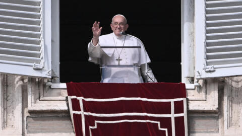 A file photo showing Pope Francis waving from the window of the apostolic palace overlooking St. Peter's square during the weekly Angelus prayer on October 29, 2023 in the Vatican.