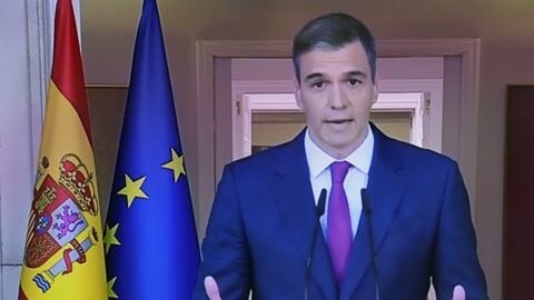 A picture of a TV screen taken on April 29, 2024 in Madrid shows Spain Prime Minister Pedro Sanchez announcing that he stays as prime minister despite political harassment.