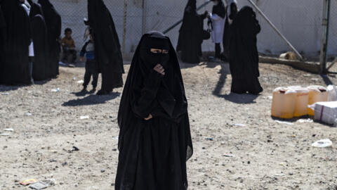 Family members of suspected Islamic State (IS) group fighters held in the al-Hol camp, in the northern Raqa region in Syria, on September 14, 2021.