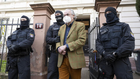 German special police forces detain Heinrich XIII Prinz Reuss after searching a house in Frankfurt / Main, western Germany, on December 7, 2022.