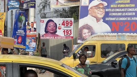 Candidate posters line the streets of Kinshasa. 