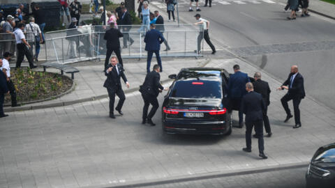 Security officers move Slovak PM Robert Fico in a car after a shooting incident in Handlova, Slovakia, May 15, 2024.