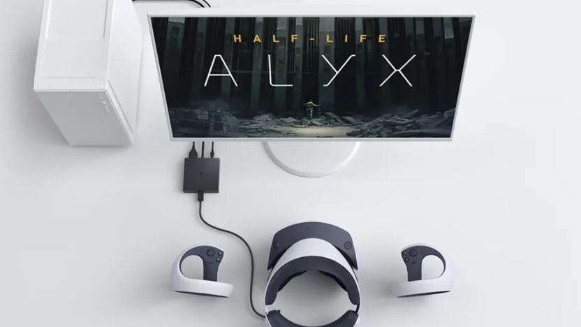 PS VR2 headset connected to a PC. The monitor shows the logo for Half-Life: Alyx.
