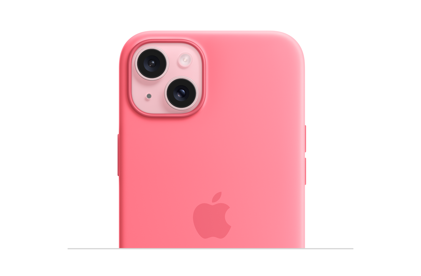 Capa de silicone rosa com MagSafe, com logotipo da Apple gravado no centro, encaixada no iPhone 15 rosa, com recorte para câmera.